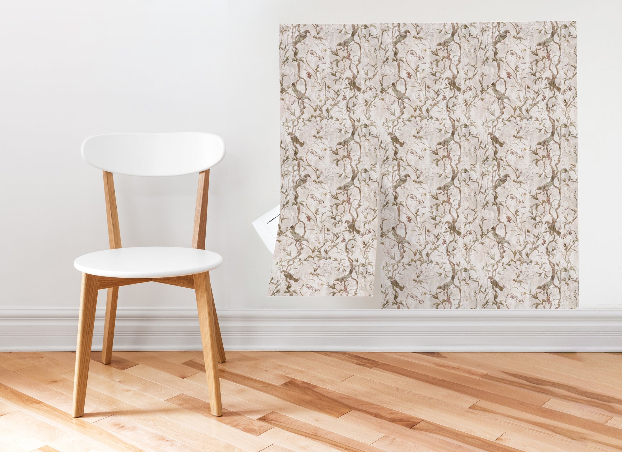 A Meet Cute peel and stick wallpaper sheet applied as a framed wall panel beside a wooden chair